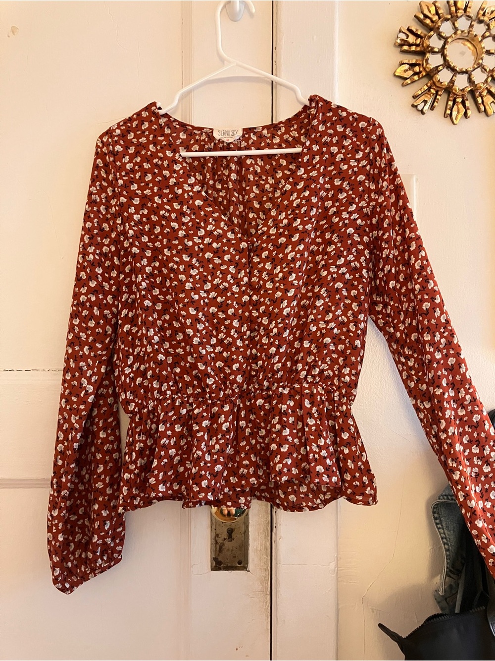 Sienna Sky long sleeve floral rust color blouse with front buttons